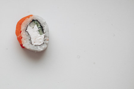 Beautiful delicious sushi. Sushi delivery. Advertising sushi rolls made of fish and cheese.の写真素材