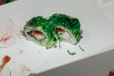 Beautiful delicious sushi. Sushi delivery. Advertising sushi rolls made of fish and cheese.の写真素材