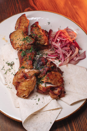 pork kebab on a plate. Juicy delicious foodの写真素材