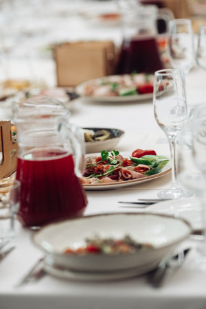 restaurant table setting, banquet, dishes are on the tableの写真素材