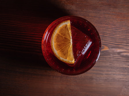 A beautiful bright cocktail. Restaurant, a glass with a drink is on the tableの写真素材