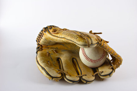Fielders baseball mitt or glove with baseball on white