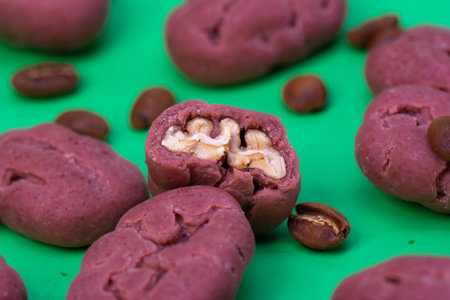 Pecan on a green background background. Close-up of pecans in a shell as a packaging design element....