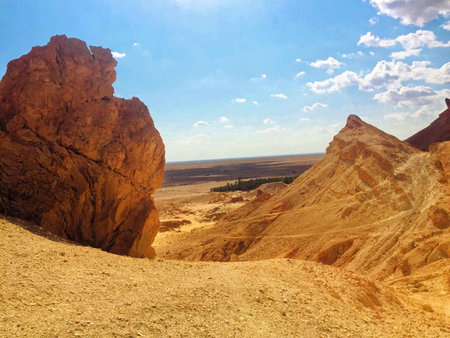 large boulders in the desert under the blue sky