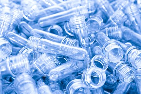 A pile of preforms for making plastic bottles. Blank for the production of containers.の写真素材
