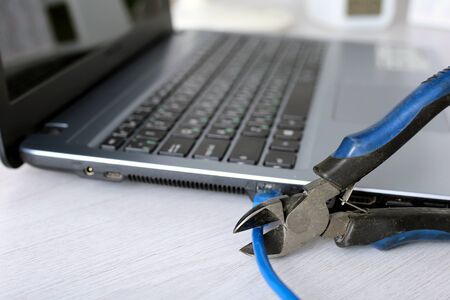 Internet wire cut. Danger of computer virus nascent. Stop internet madness. Prevention of unauthorized access.の写真素材