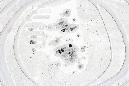 Black and white acrylic paint mixed on one plane forming an abstraction. Black and white animal-like...