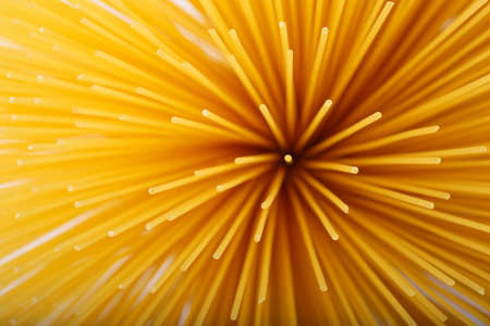 Long tubular pasta diverge with a fan from one point, a top view.の写真素材