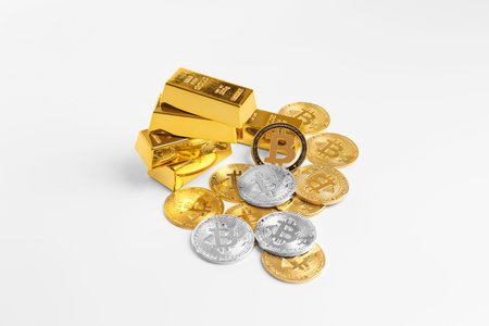 Heap of bitcoin coins and gold bars isolated on white background. Cryptocurrency close-up on...