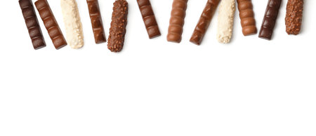 Chocolate bars of different types on white isolated top view with space for text. Milk, white, black chocolate on a white background.の写真素材