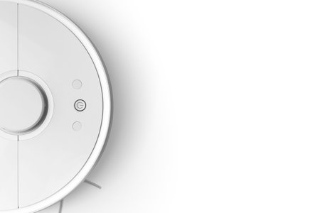 Modern autonomous smart robot vacuum cleaner on white background top view with space for text. Self-propelled cleaning robot. floor cleaning system. Small household appliances and home appliances.の写真素材