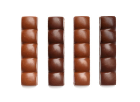 Chocolate bars made of milk and dark chocolate on a white background top view.の写真素材