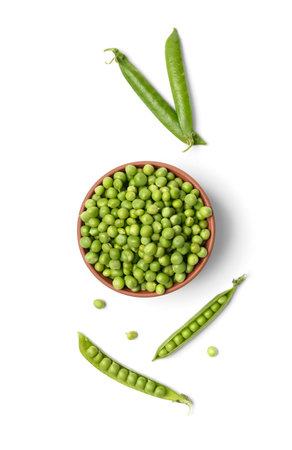 Fresh green peas in open and closed pods, peeled peas in a clay bowl and scattered large peas, isolated on a white background, top view. Vegetable protein, healthy products.の写真素材