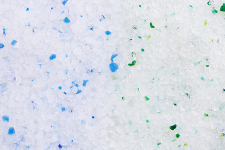 Silica gel white with green and blue crystals for cat litter, close-up. Abstract background of pure silica gel crystals. Natural pet litter. animal care.の写真素材