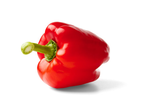 Large sweet red bell pepper isolated on white background, close-up. Useful organic products.の写真素材