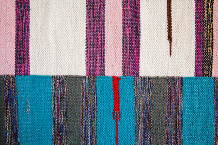 Two bright textile striped rugs. Textile texture. View from the top