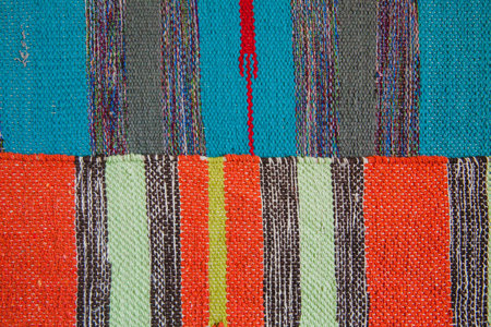 Two bright textile striped rugs. Textile texture. View from the top