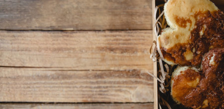Heart-shaped buns in an open craft box close-up. Valentines Day Gift Flat lay banner with copy spaceの写真素材