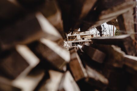 A pile of used wooden planks with nails sticking outの写真素材