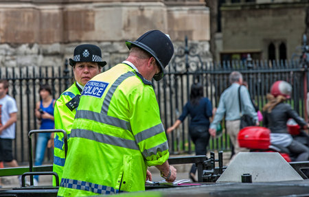 Two policemen London photographed in front of the Palace of Westminster on St  Margaret ST  A man...