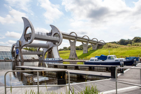 The Falkirk Wheel is a rotating boat lift in Falkirk, Scotland, connecting the Forth and Clyde Canal...