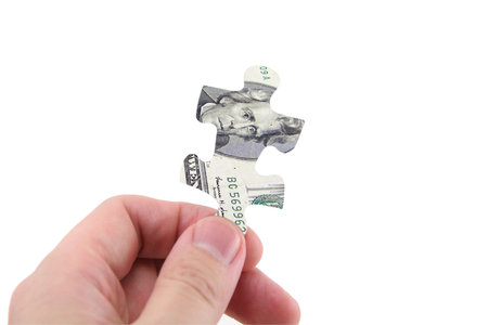 hand hold us dollar puzzle