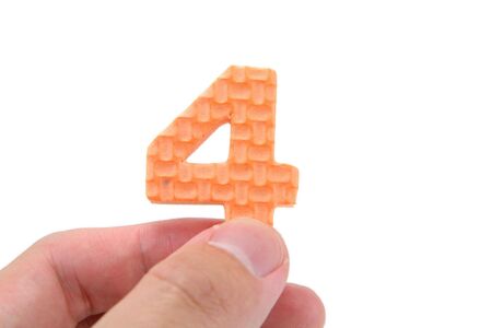 isolated hand holding color numberの写真素材