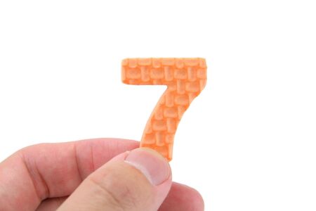 isolated hand holding color numberの写真素材