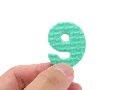 isolated hand holding color numberの写真素材