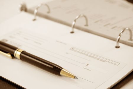 cheque with notebook for business conceptの写真素材