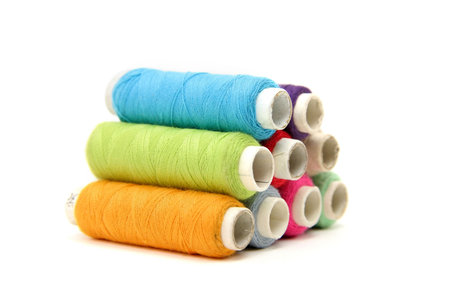 many colorful spools of thread