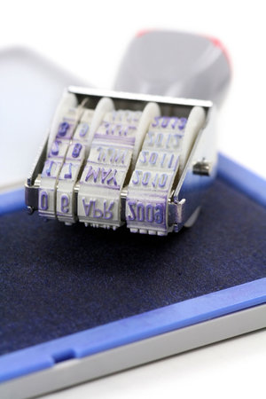 Date Stamp Close Up with blue inkpadの写真素材