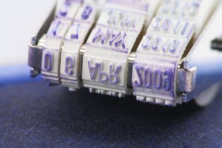 Date Stamp Close Up with blue inkpadの写真素材