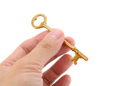 gold key with white background, concept of successの写真素材