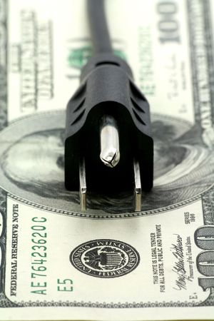 power cord and us dollar, concept of expensive energy billの写真素材