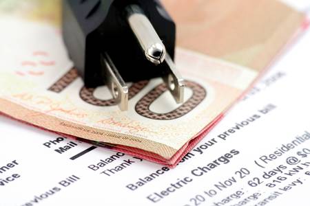 power cord and canadian dollar, concept of expensive energy billの写真素材