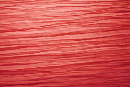 crumpled red paper for backgroundの写真素材