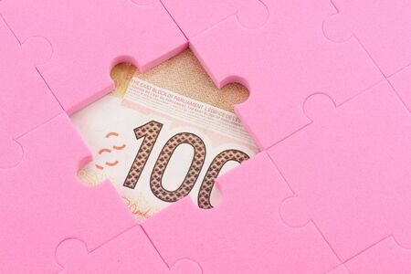 canadian dollar and puzzles close up, business conceptの写真素材