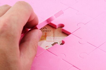 canadian dollar and puzzles close up, business conceptの写真素材