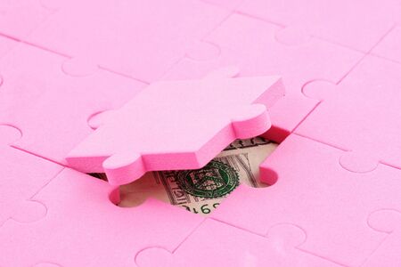 us dollar and puzzles close up, business conceptの写真素材
