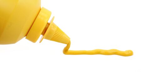 a bottle of yellow mustard with white backgroundの写真素材