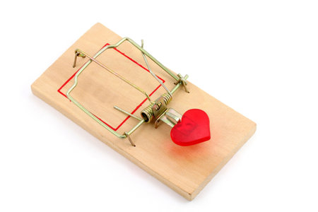red heart and Mousetrap, love concept, with white backgroundの写真素材