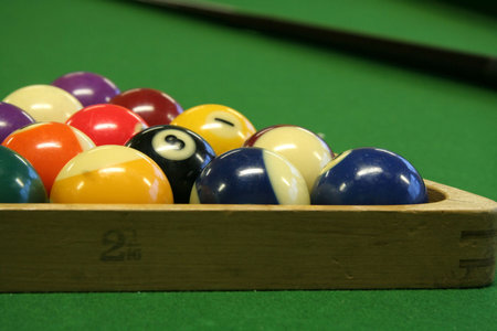pool balls on green pool table