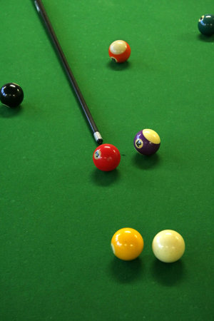 pool balls on green pool table