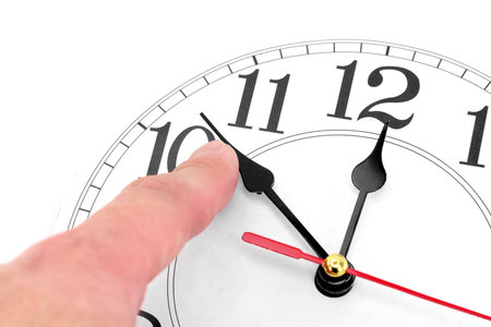 hand and clock with white background, concept of time control