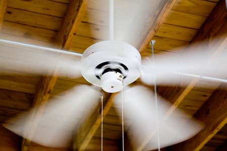ceiling fan in a old wooden houseの写真素材