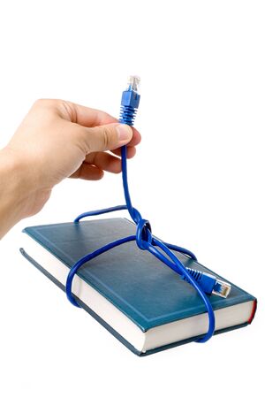 Network cable and book, concept of online educationの写真素材
