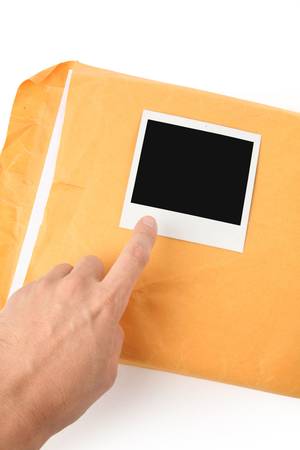 big envelope and photo with white backgroundの写真素材