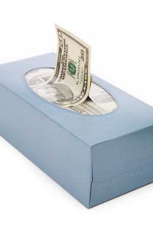 us dollars in a tissue box, business concept, wasting moneyの写真素材