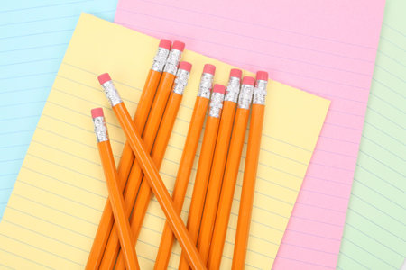 colorful notepaper and pencils close up shot